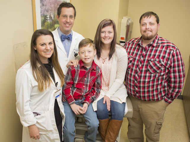Liver transplant patient Erin Morris, second from right, with her son Corbin, husband Allen, right, Roman Perri, M.D., and Heather O’Dell, ANP-BC